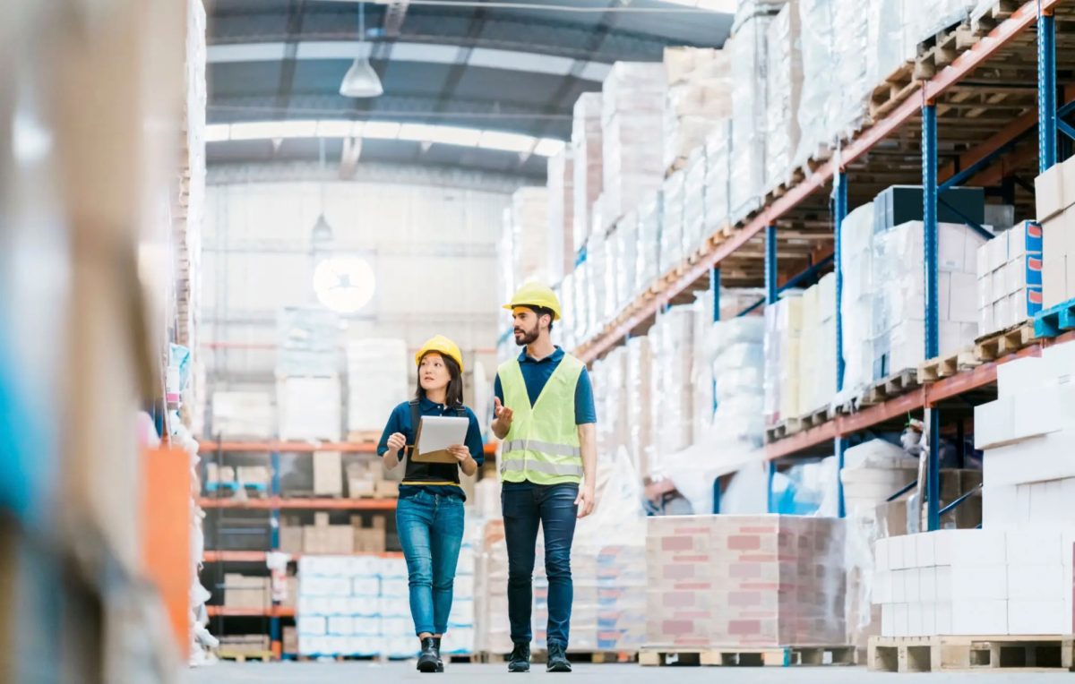 Industrial staffing workers walking through a warehouse